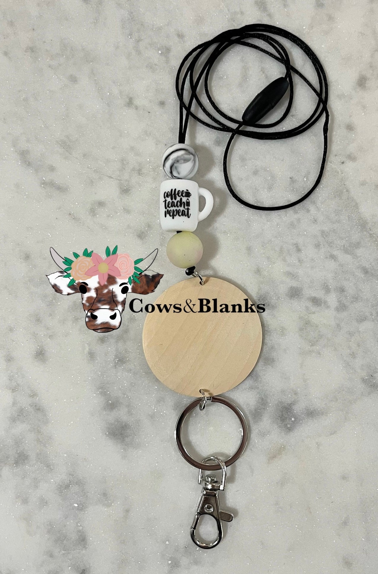 COFFEE TEACH REPEAT ON A CUP SHAPED SILOICONE BEAD WITH MARBLE YELLOW FADING INTO PINK BEADS TEACHER LANYARD.