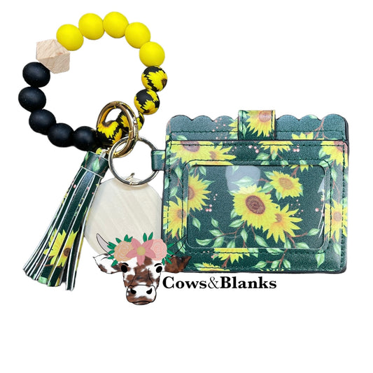 Wallet/Wristlet with Dark Green with Sunflowers Cardholder and a Black, Yellow, and Sunflower Silicone Beaded Wristlet with a Wooden Accent Bead, Gold Hardware, Matching Tassel, and a Wooden Disc