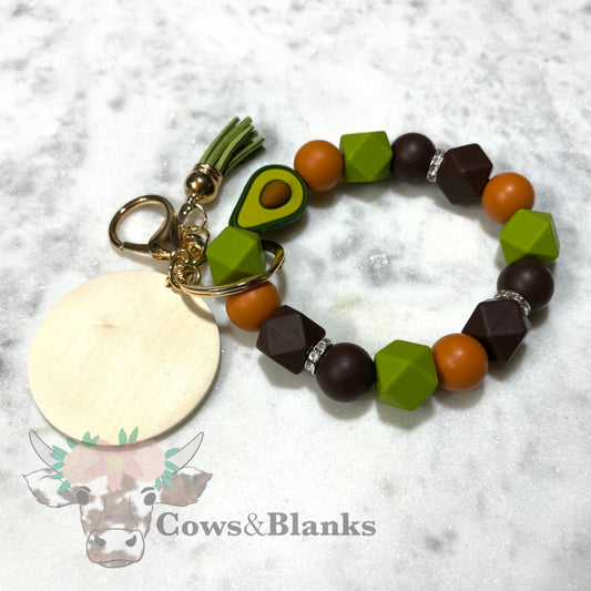AVOCADO SILICONE BEADED STRETCH WRISTLET BRACELET KEYCHAIN WITH WOODEN DISC AND TASSEL