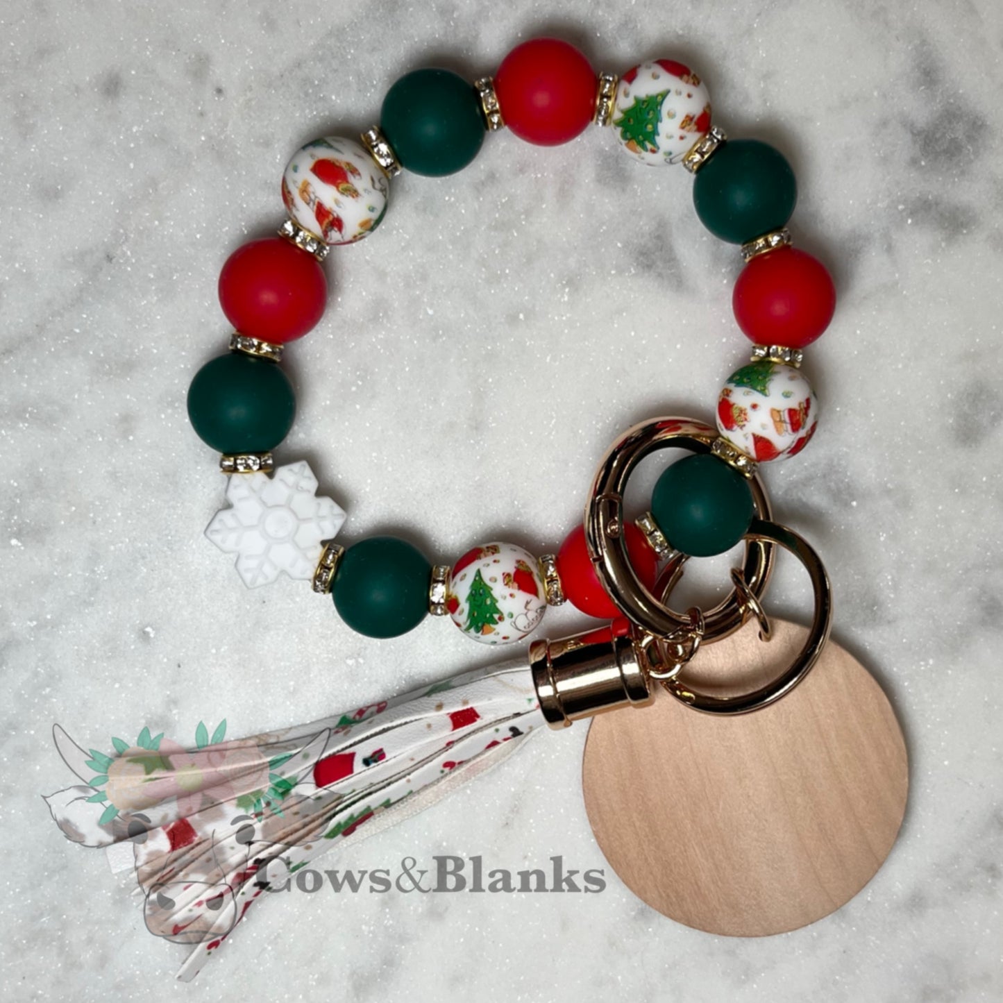 Christmas Snowflake Silicone Bead with Decorative White Bead with Santa, Tree, and Snowman, Red, & Green Accents Beaded Stretch Wristlet Bracelet Keychain with Wooden Disc and Tassel