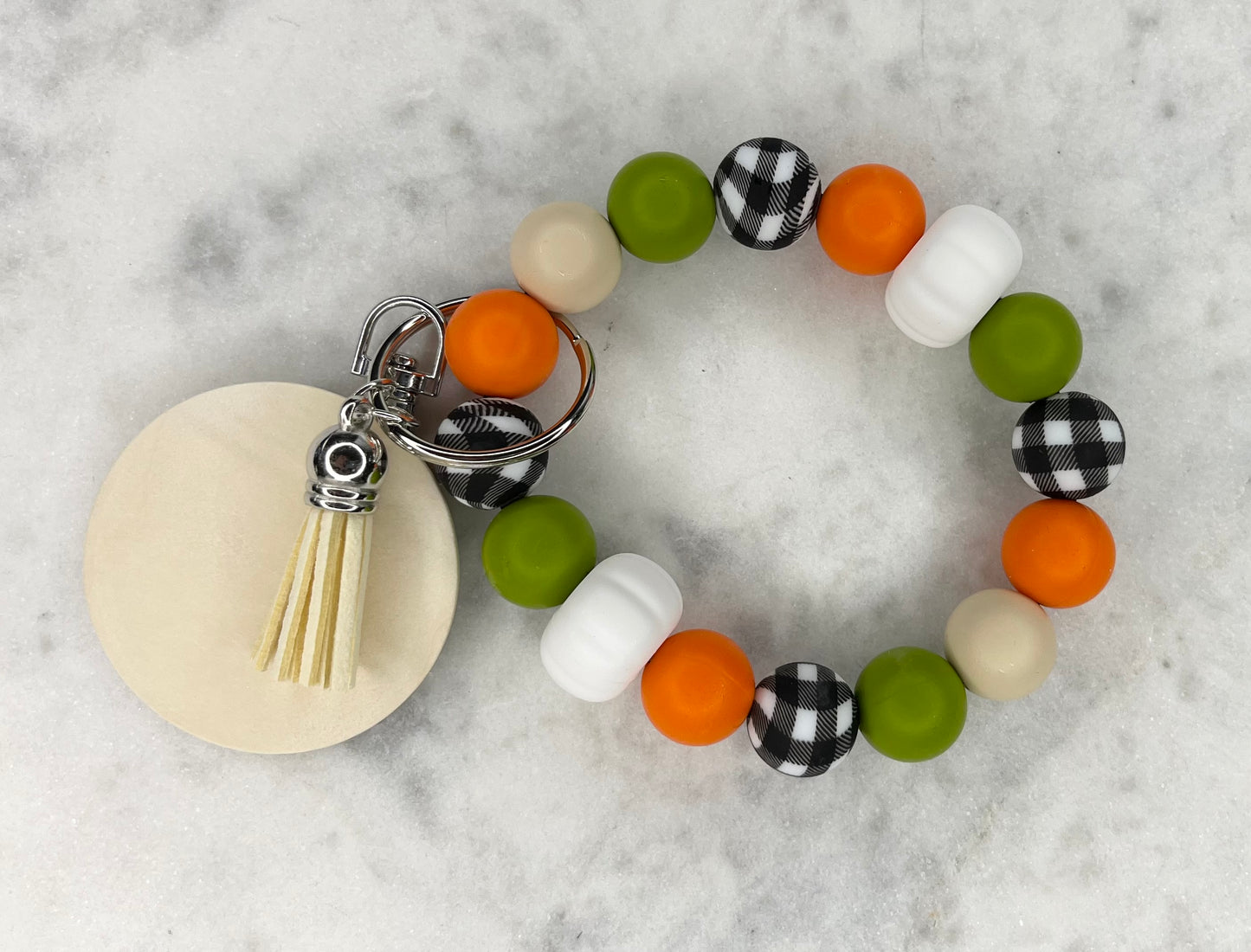 AUTUMN WHITE PUMPKIN SILICONE WITY ORANGE CREAM, OLIVE AND BLACK GINGHAM BEADED STRETCH WRISTLET BRACELET WITH WOODEN DISC