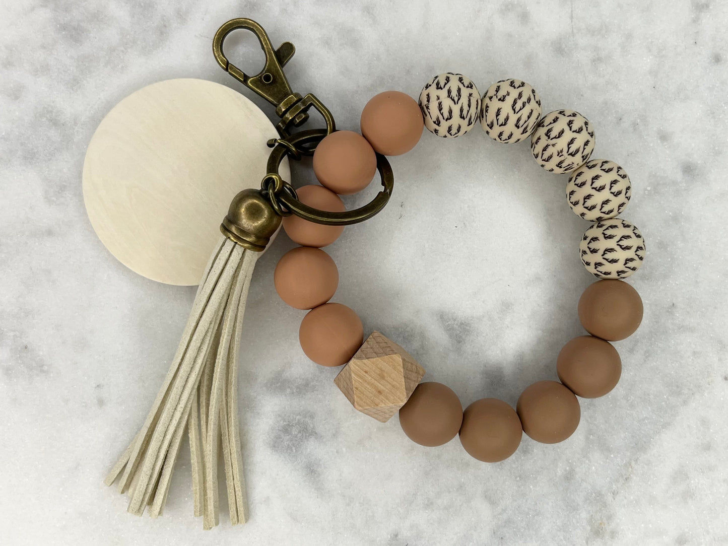 ANETLER WARM TONES SILICONE STRETCH WRISTntler Warm TONES SILICONE STRETCHABLE WRISTLET BRACELET KEYCHAIN WITH WOODEN DISC AND TASSEL