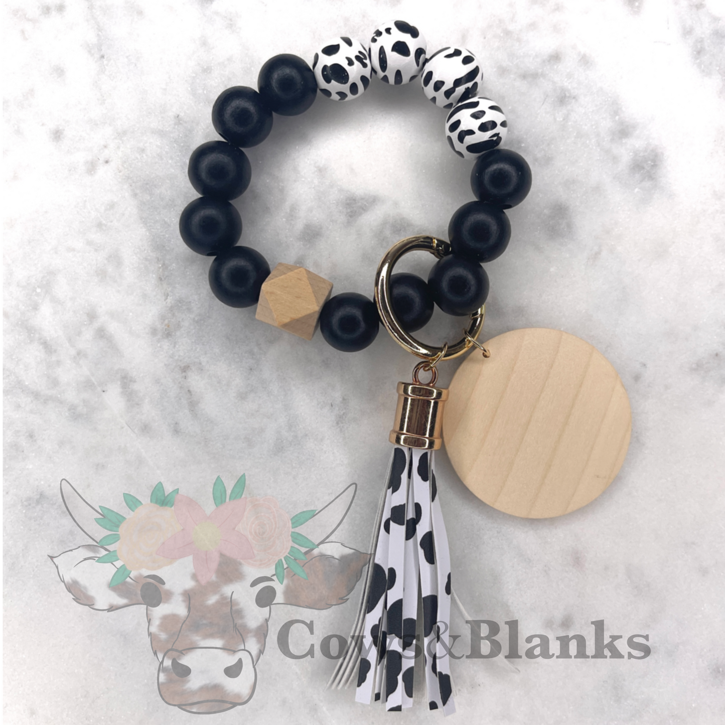 COW PRINT WOODEN WRISTLET BRACELET WITH WOODEN DISC AND TASSEL