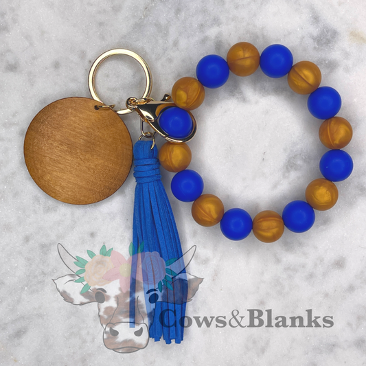 It takes two. Blue and Marble Gold Silicone Beaded Stretch Wristlet Bracelet Keychain with Wooden Disc and Tassel
