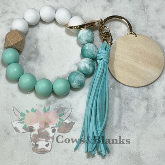Trio Plus One: Ocean Wave Teal Silicone Stretch Beaded Wristlet Bracelet Keychain with Wooden Disc and Tassel