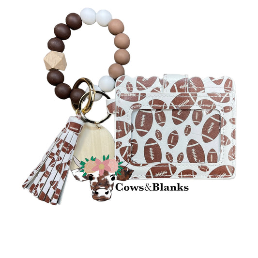 Wallet/Wristlet with White with Footballs Cardholder with a White, Chocolate, and Mocha Silicone Beaded Wristlet with a Wooden Accent Bead, Gold Hardware, Matching Tassel, and a Wooden Disc