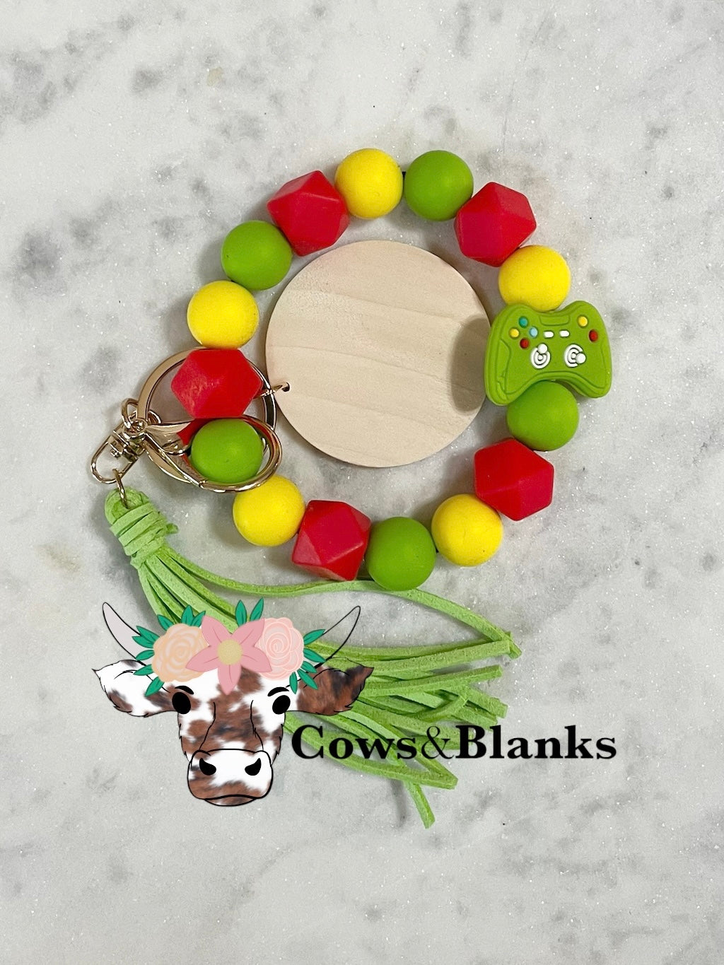 Gamers Delight Wristlet with Game Controller Silicone Bead.  Happy Colors of Red, yellow, and Lime Green Beads with a Wooden Disc, Tassel, and Gold Hardware