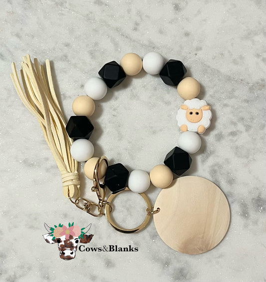 Little Lamb Stretch Wristlet Key Chain with Cream, Black, and White Beads.