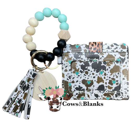 Wallet/Wristlet with Bessie the Cow on Cow-print Cardholder and with Aqua and Black Silicone Beads Paired with Wooded Beads Wristlet with Wooden Accent Bead and Matching Tassel with a Wooden Disc