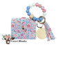 Wallet/Wristlet with A Springtime Flower Garden Cardholder and a Silicone White, Blue, and Floral Printed Beads Wristlet with Wooden Accent Bead, and a Wooden Disc With a Matching Tassel