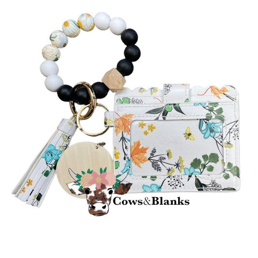 Wallet/Wristlet with White with Spring Flowers Cardholder with a Black, White, and Spring Flower Silicone Beaded Wristlet with Gold Hardware, Matching Tassel, and a Wooden Disc