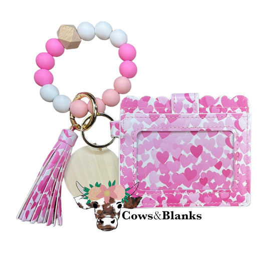 Wallet/Wristlet with White with Dark and Light Pink Heart Cardholder with a White, Pink, and Light Pink Silicone Beaded Wristlet with a Wooden Accent Bead, Gold Hardware, Matching Tassel, and a Wooden Disc