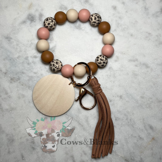 Paisley Silicone Bead with Pink, Beige, and Tan Beaded Stretch Wristlet Bracelet Keychain with Wooden Disc and Tassel