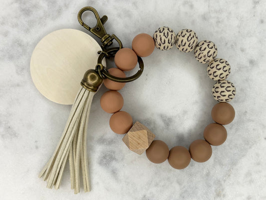 Antler Warm Tones Silicone Stretch Wristlet Bracelet Keychain with Wooden Disc and Tassel