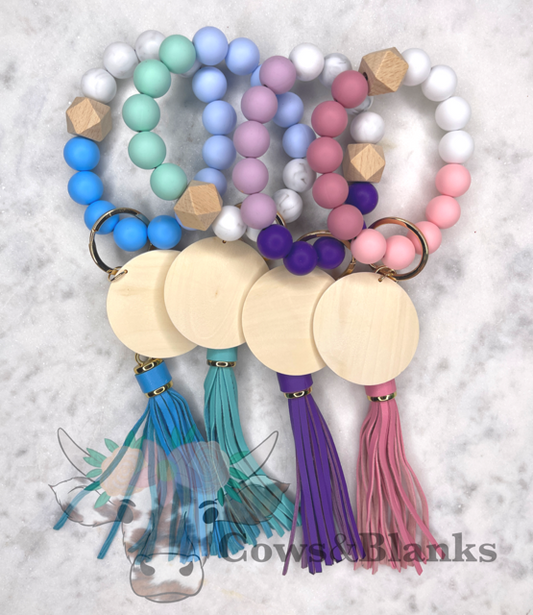 Marbled Pastels and Grays Stretch Silicone Wristlet Bracelet Keychain with Wooden Disc and Tassel