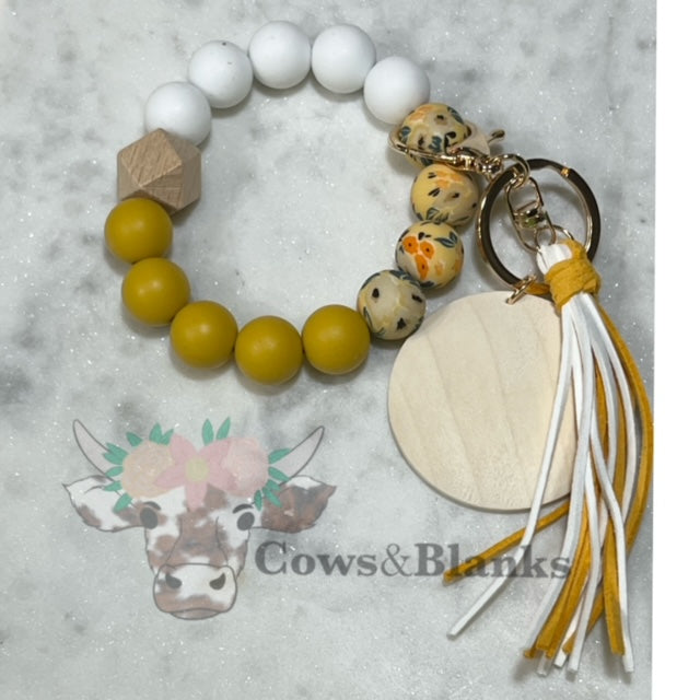 Mustard Flowers:  Yellow Floral Silicone Stretch Beaded Wristlet Bracelet Keychain with Wooden Disc and Tassel